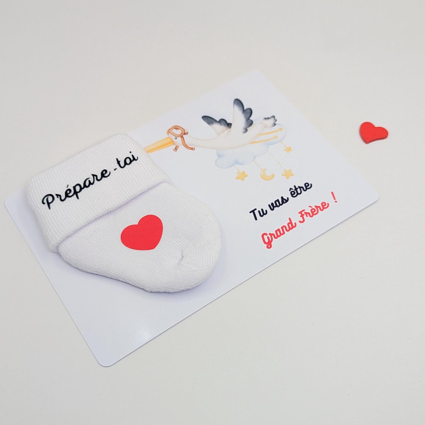 Carte avec chaussette personnalisée pour annoncer la grossesse.