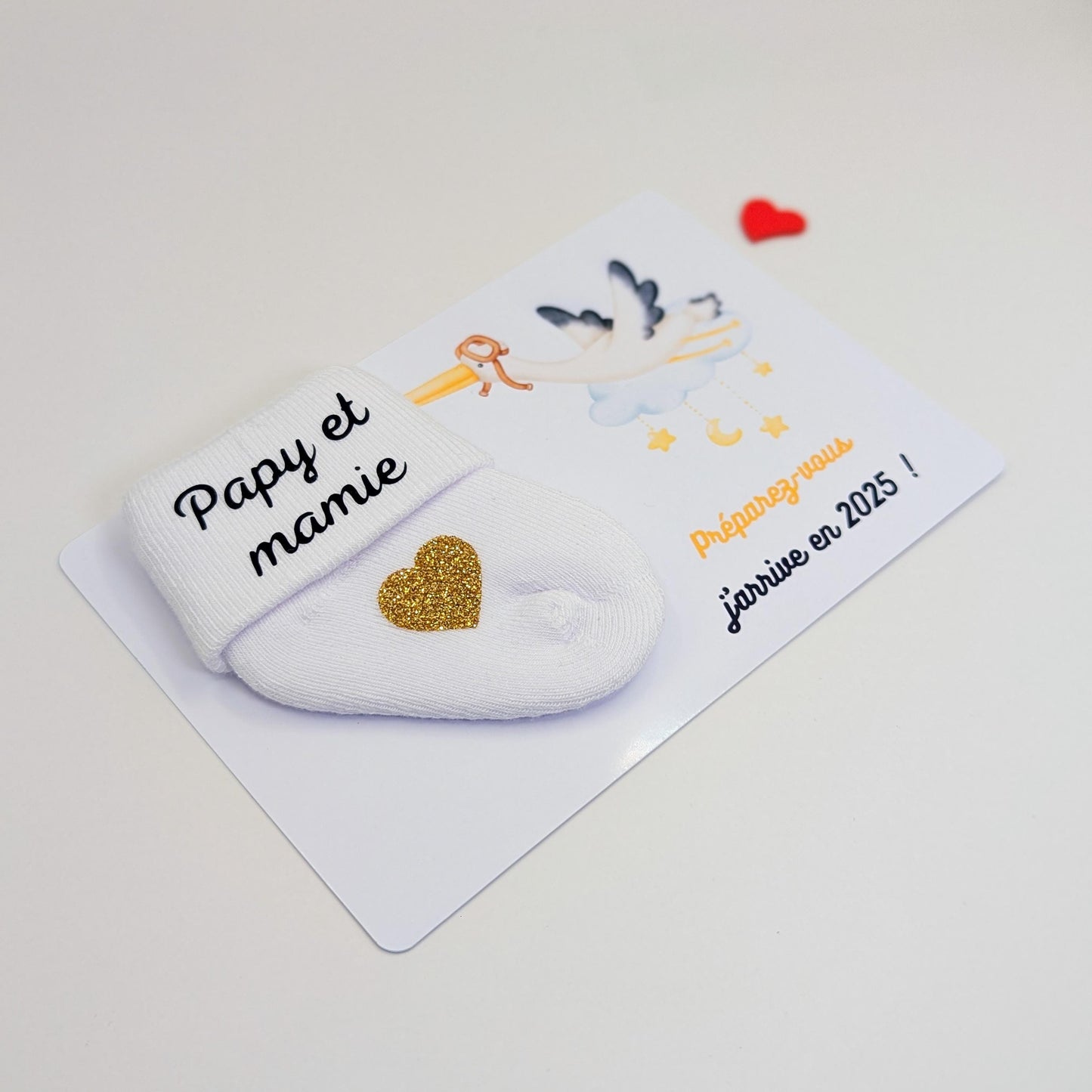 Carte avec chaussette personnalisée pour annoncer la grossesse.